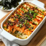 Miso Salmon Sushi Bake – Easy Oven-Baked Japanese-Inspired Casserole 10 Close-up of baked Miso Salmon Sushi Bake with a serving scooped out