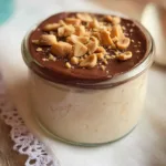 Cottage cheese protein pudding with chocolate and chopped peanuts