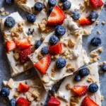 High Protein Greek Yogurt Bark Frozen Greek yogurt bark pieces with fruit and granola