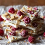 Frozen yogurt bark with raspberries and graham crackers
