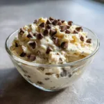 glass bowl of cottage cheese cookie dough topped with chocolate chips