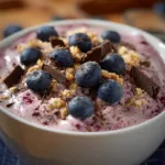 Protein Fluff – What It Is, How to Make It & 3 Variations 9 Protein Fluff topped with blueberries, granola, and dark chocolate shavings