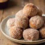 Crispy Protein Donut Holes Air Fryer – Just 3 Ingredients 7 Crispy cinnamon sugar protein donut holes air fryer on a plate