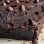 close-up of chocolate black bean protein bar topped with chocolate chips