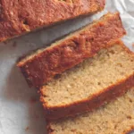 Close-up of sliced protein banana bread on parchment