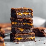 our stacked fudgy salted caramel brownies with glossy chocolate and dripping caramel