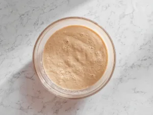 Healthy Flourless Banana Bread – No Flour, No Fuss, All Flavor 13 Bowl of smooth flourless banana bread batter on marble countertop