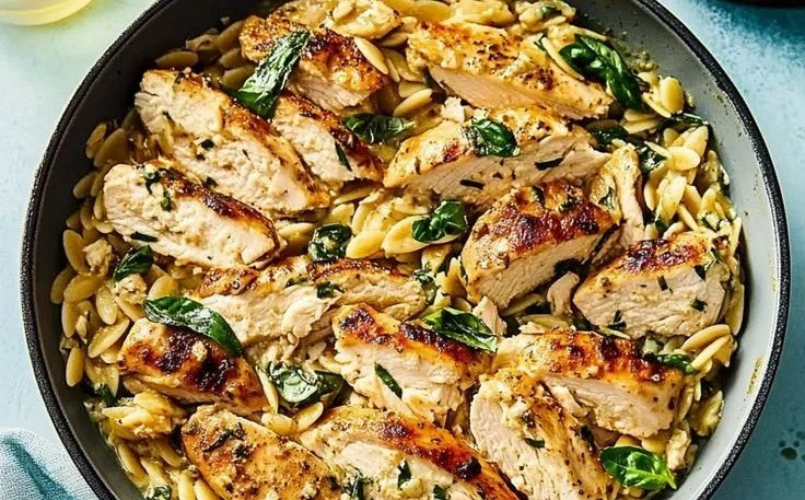 Flavorful Mediterranean Chicken Orzo 4 Delicious plate of Mediterranean Chicken Orzo garnished with herbs and vegetables