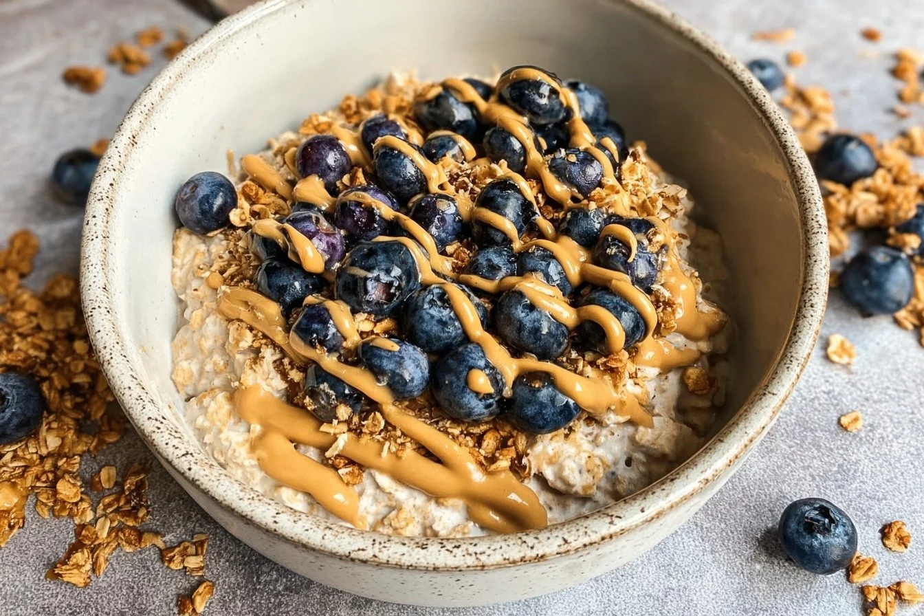 A bowl of classic overnight oats topped with fruits and nuts for a healthy breakfast.