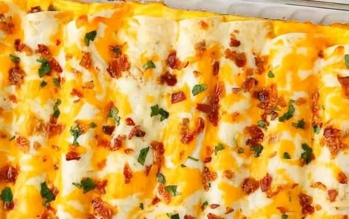Breakfast Enchiladas 4 Delicious breakfast enchiladas filled with eggs, cheese, and fresh toppings