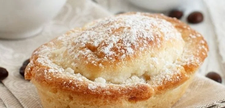 Delicious Italian breakfast with espresso and fresh pastries on a table.