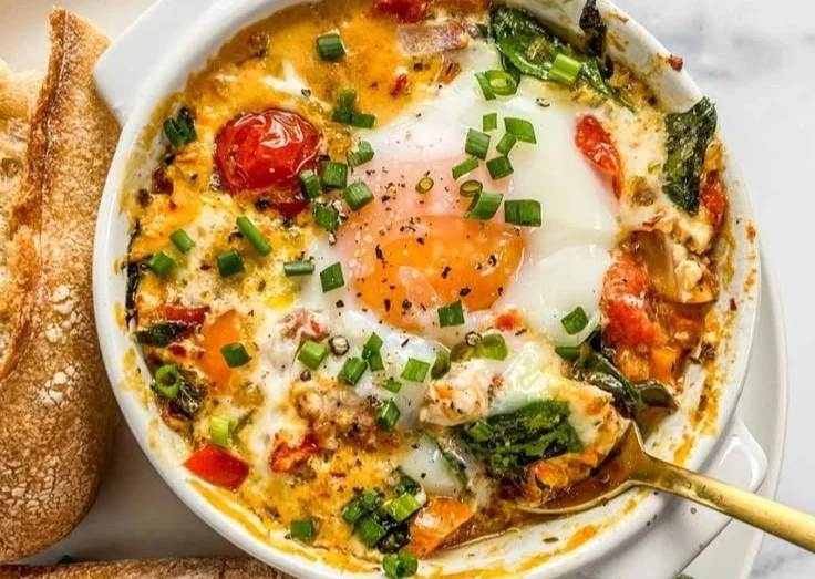 Baked Feta Eggs with Tomatoes and Spinach