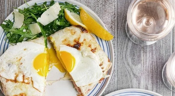 Delicious breakfast lasagna with layers of eggs, cheese, and savory meats.