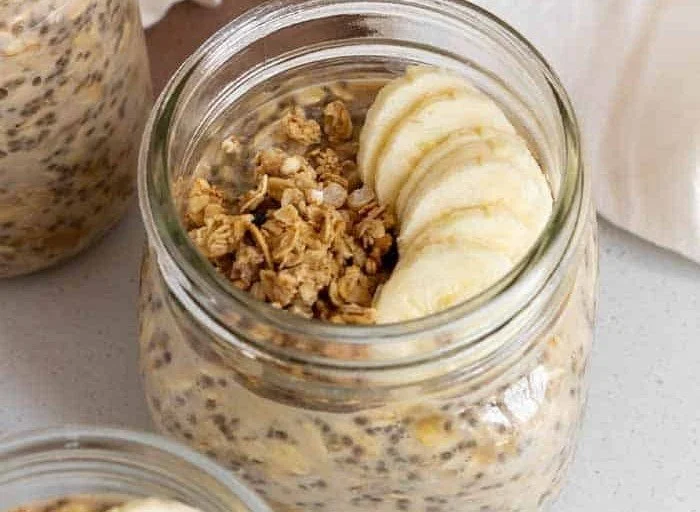 Bowl of brown sugar overnight oats topped with fruit and nuts