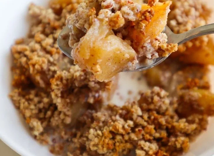 Healthy Breakfast Apple Crumble 5 Healthy breakfast apple crumble topped with oats and nuts.