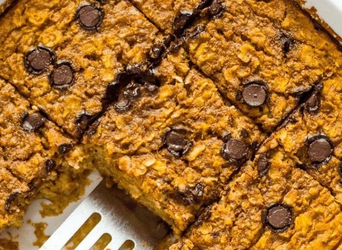 Delicious Pumpkin Baked Oatmeal topped with nuts and spices